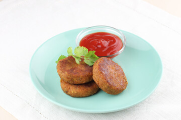 Vegetable cutlets with tomato sauce