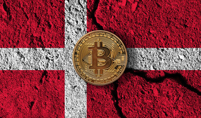 Bitcoin crypto currency coin with cracked Denmark flag. Crypto restrictions