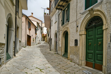 A small street between the old houses of Agnone, a medieval village in the mountains of the Molise region, Italy.