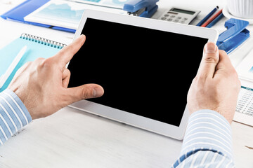 businessman with a tablet, works in the office