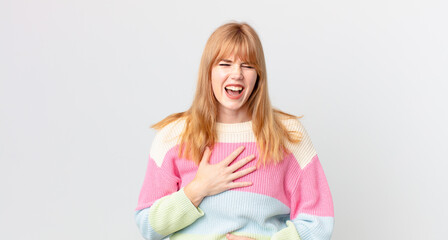 pretty red head woman laughing out loud at some hilarious joke