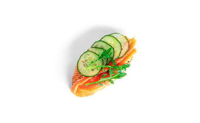 Bruschetta with cream cheese, salmon, cucumber and arugula leaves isolated on a white background. Toast isolated. Sandwich isolated. Sandwich with shrimps, salmon and cheese.