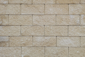 Texture of a wall made of concrete stones close-up