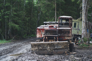 Old rusty abandoned forestry equipment. Ukrainian Carpathian mountains.