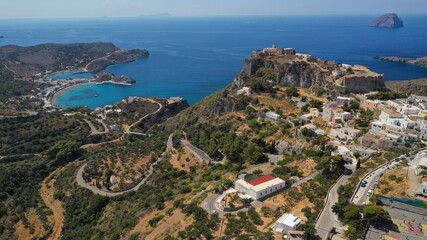Fototapeta na wymiar Aerial drone photo above iconic medieval castle and main village of Kithira island overlooking beautiful double bay and beach of Kapsali, Kythira island, Ionian, Greece