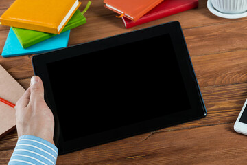 businessman with a tablet, works in the office