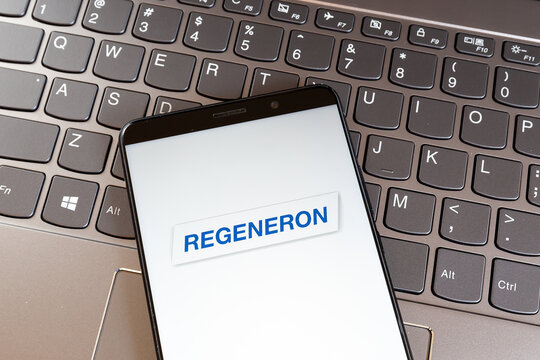 Toronto, Canada - March 18, 2021: Regeneron logo on smartphone screen on keyboard. Regeneron Pharmaceuticals, Inc. is an American biotechnology company. 