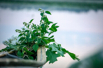 meditation canoe boat trip in midsummer evening with flower decoration