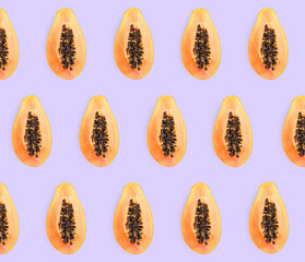 Delicious cut papaya fruits on lilac background, flat lay