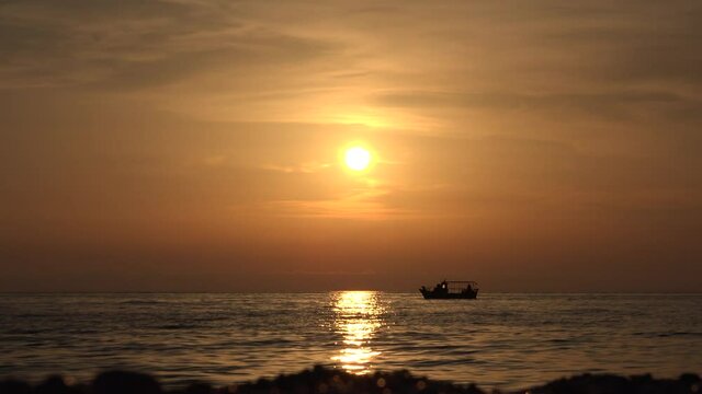 Fishermen in Boat on Sea at Sunset, Fishing in Ocean at Sundown, Isolated Ship in Waves