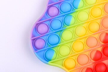 Bright colorful children's toy made of silicone designed to relieve stress