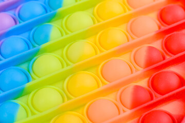 Bright colorful children's toy made of silicone designed to relieve stress