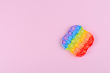 Bright colorful children's toy made of silicone designed to relieve stress
