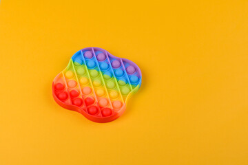 Bright colorful children's toy made of silicone designed to relieve stress