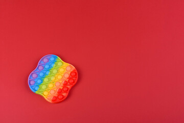 Bright colorful children's toy made of silicone designed to relieve stress