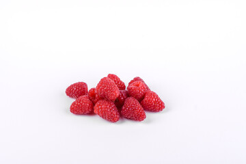 Ripe raspberries with raspberry leaf isolated on a white background