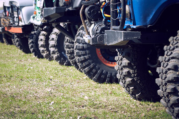 General view of 4x4 off-road vehicles built before the start of extreme competitions. Cross-country...