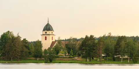 church on a lakeshore in the Swedish countryside