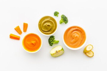 Baby feeding with fruits food and fresh vegetables, top view