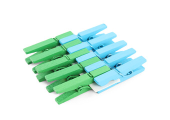 Set of colorful wooden clothespins on white background