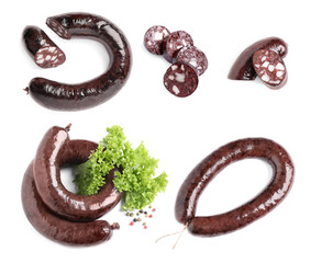 Set with tasty blood sausages on white background