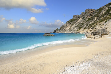 The spectacular Aspri Ammos beach on the rocky southwest coast of the Greek island of Othonoi in the Ionian Sea