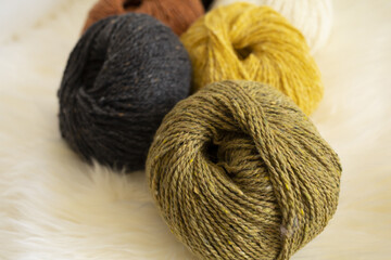 tweed wool yarn skeins, close up, white background