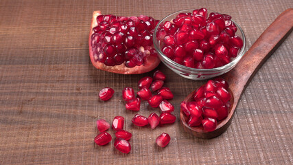 Fresh Pomegranate, rich in natural antioxidants. Concept of red fruits, vitamins and natural antioxidants to the skin for beauty.