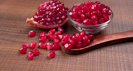 Fresh Pomegranate, rich in natural antioxidants. Concept of red fruits, vitamins and natural antioxidants to the skin for beauty.
