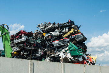 Pile of crushed junk cars on scrapyard