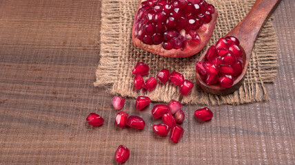 Fresh Pomegranate, rich in natural antioxidants. Concept of red fruits, vitamins and natural antioxidants to the skin for beauty.