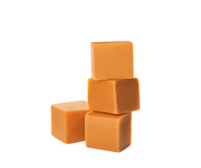 Heap of caramel candies on white background