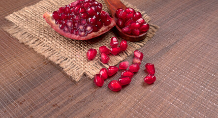 Fresh Pomegranate, rich in natural antioxidants. Concept of red fruits, vitamins and natural antioxidants to the skin for beauty.