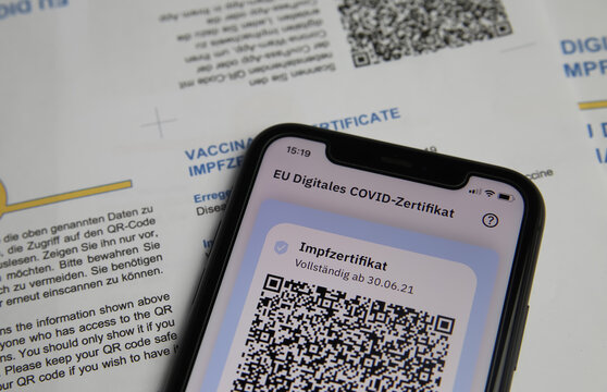 Viersen, Germany - June 24. 2021: Closeup of mobile phone screen with QR-Code of digital covid-19 vaccination certificate covpass app