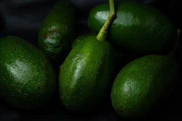 Fresh avocado isolated on black background.