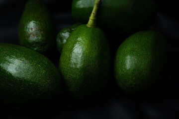Fresh avocado isolated on black background.