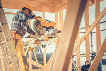 Construction Contractor Worker Using Powerful Wood Saw