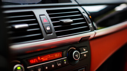 Modern car air conditioning grill and buttons.