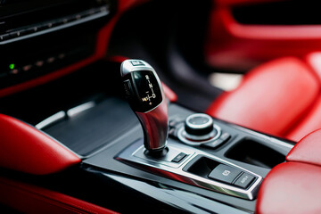 Automatic gear stick of a modern car. Modern car interior details. Close up view. Automatic...