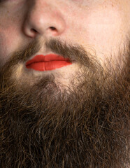 Bearded Man with Red Lipstick on His Lips , handsome pride transgender portrait lgbtq, transsexual concept