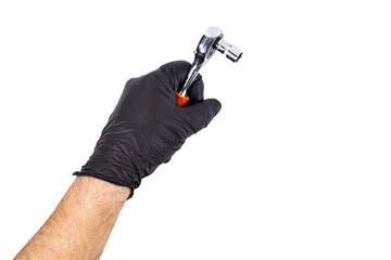 Hand-grip Ratchet or wrench  in the hand of a man in a black glove on a white isolated