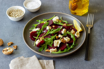 Beetroot salad with cheese, arugula, nuts and honey. Healthy eating. Vegetarian food.