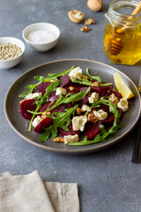 Beetroot salad with cheese, arugula, nuts and honey. Healthy eating. Vegetarian food.
