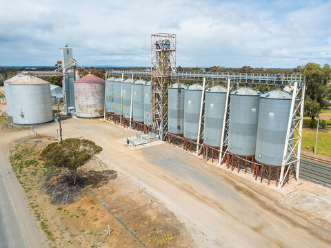 A row of grain silos at a country railway siding