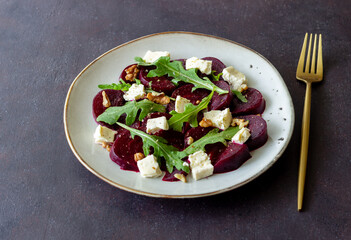 Beetroot salad with cheese, arugula, nuts and honey. Healthy eating. Vegetarian food.
