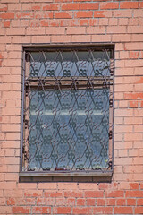 Window with metal grating close-up