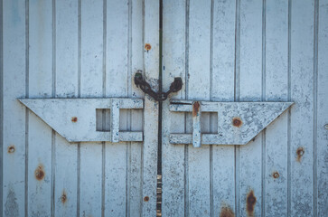 Background with closed old vintage wooden gate.