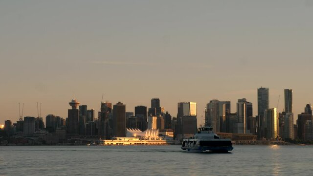 Downtown Vancouver Sunset with City Skyline and Seabus Boat Ship on Coast Harbor Waterfront Shipyards
