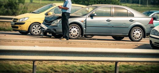 broken car and driver on highway