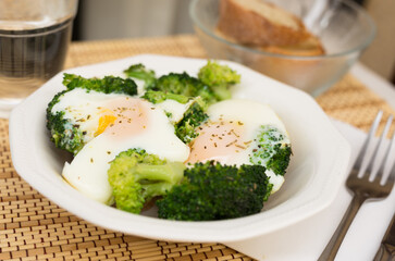breakfast of crumpled eggs with broccoli
